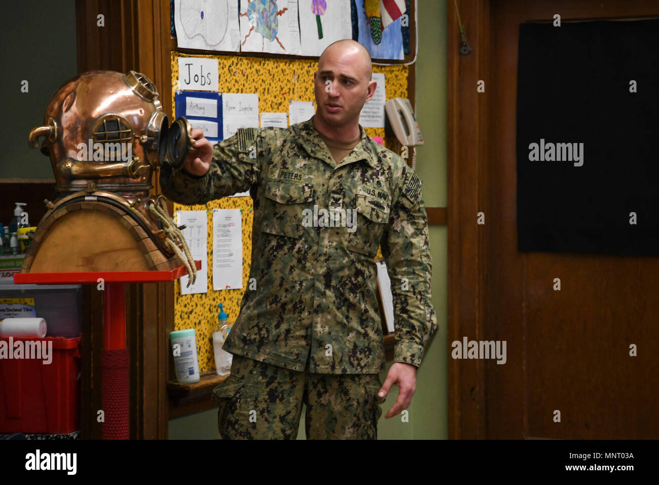 Wash. (March 14, 2018) Navy Diver 1st Class Jason Peters, from