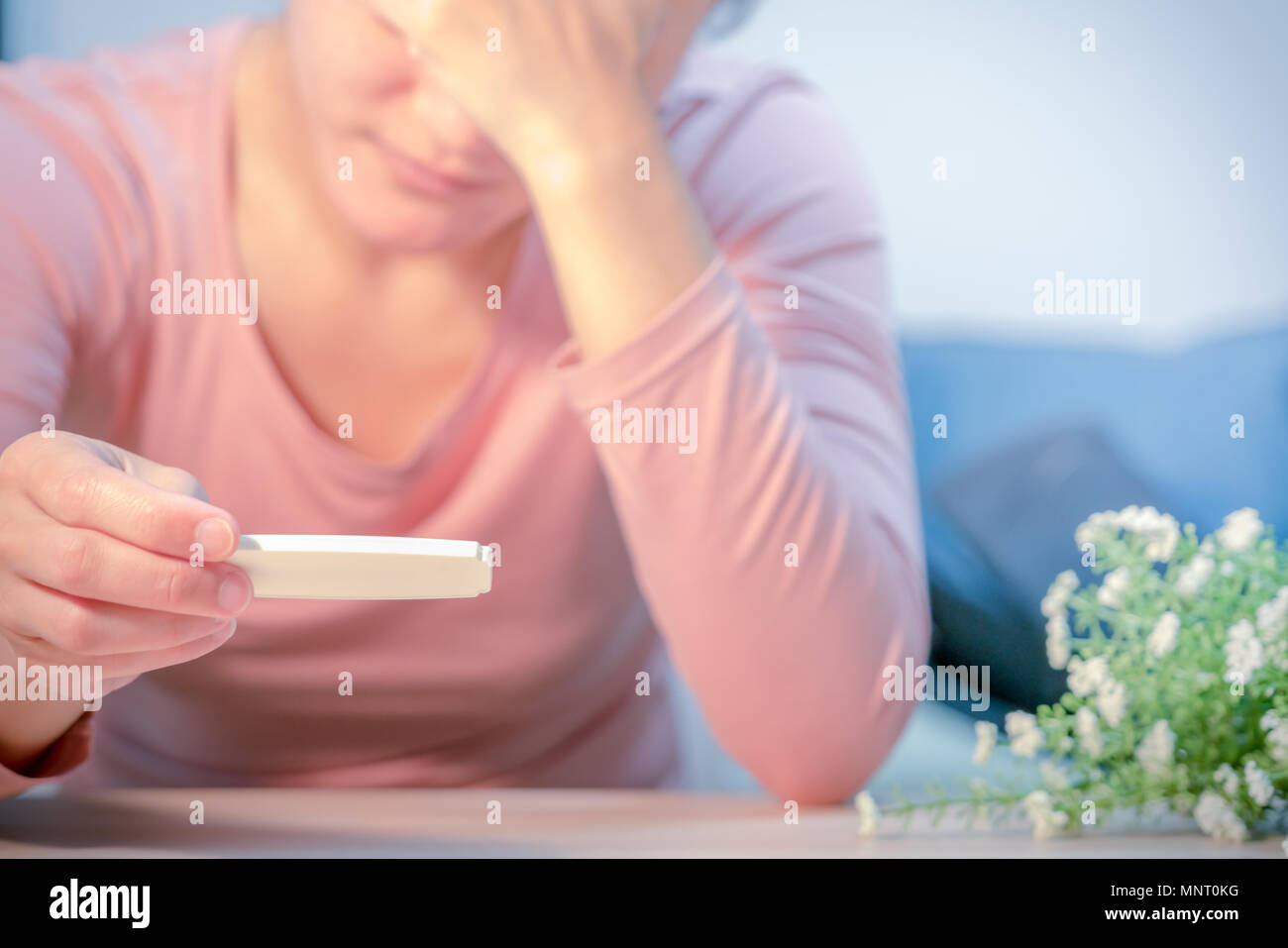 soft focus on sad women hand hold the pregnant test pad after saw the  negative test result Stock Photo - Alamy
