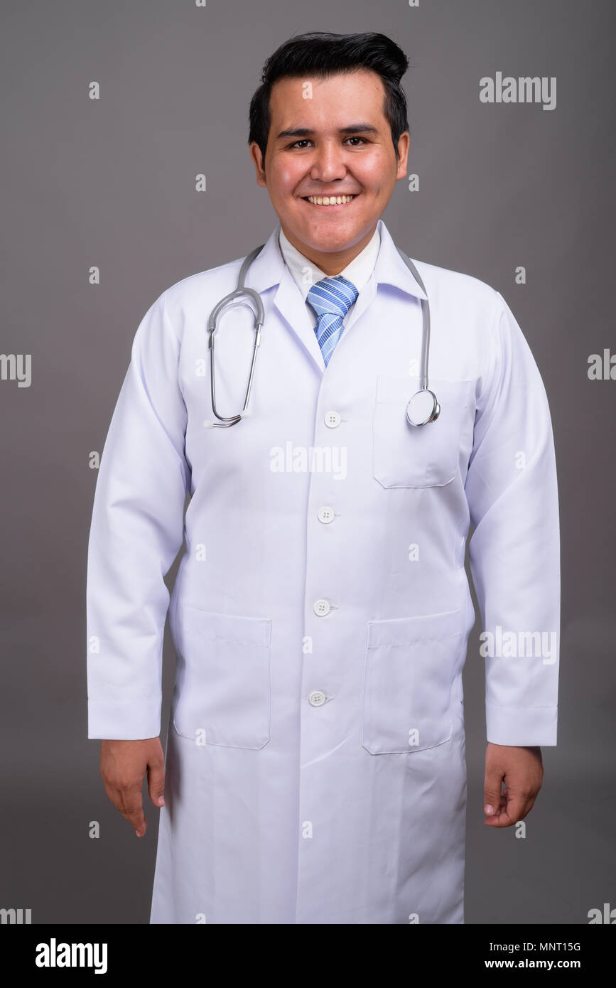 Smiling asian man doctor hi-res stock photography and images - Alamy