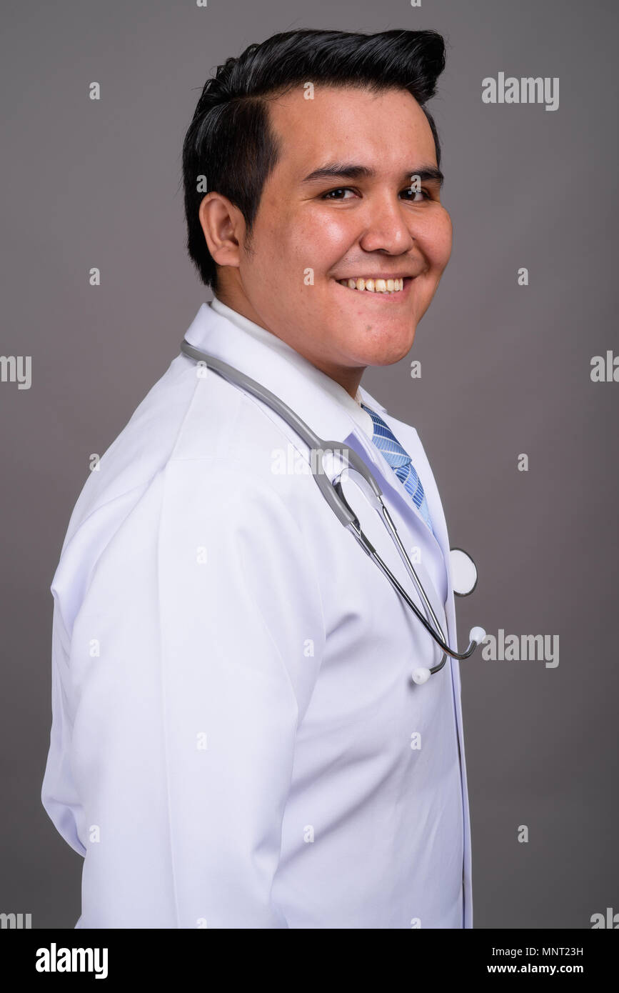Smiling asian man doctor hi-res stock photography and images - Alamy