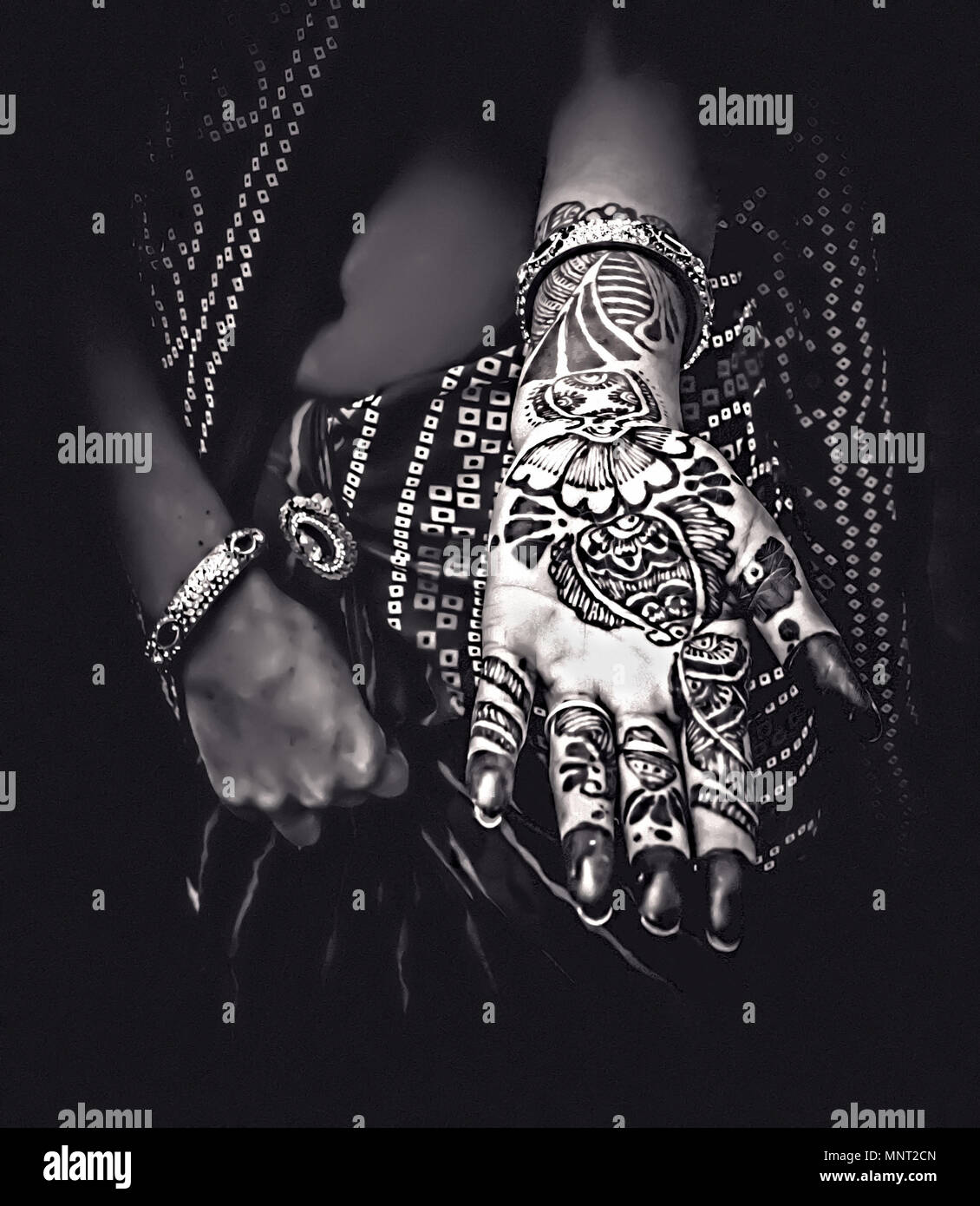 A Henna Tattoo on a young woman in Jaipur, India. Henna tattoos are an ancient form of body adornment and signify many blessing during ceremonies. Stock Photo