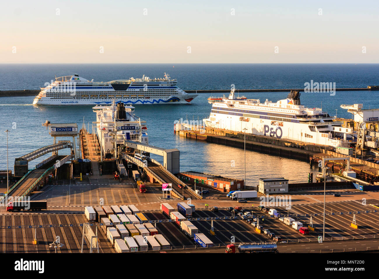 England, Dover harbour. AIDAluna coming into harbour with car ferries