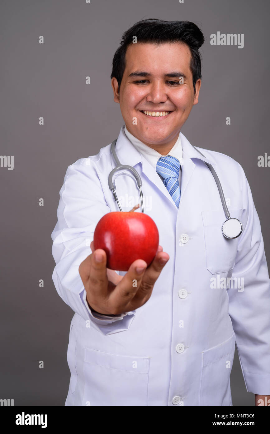 Happy asian man doctor thinking hi-res stock photography and images - Alamy