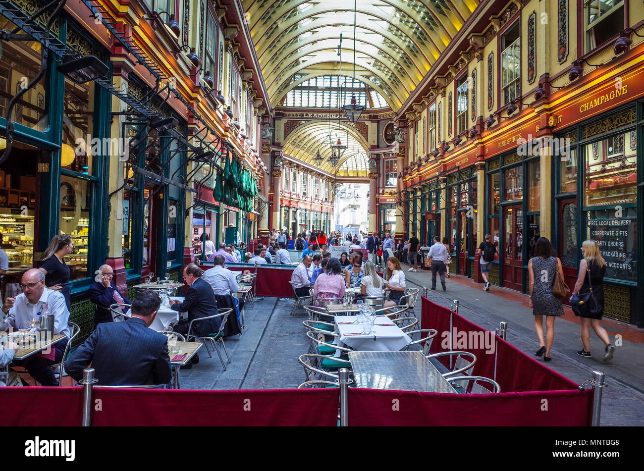 Leadenhall Market London - City workers enjoy food and drink in London's historic Leadenhall Market in the heart of the City of London financial area. Stock Photo