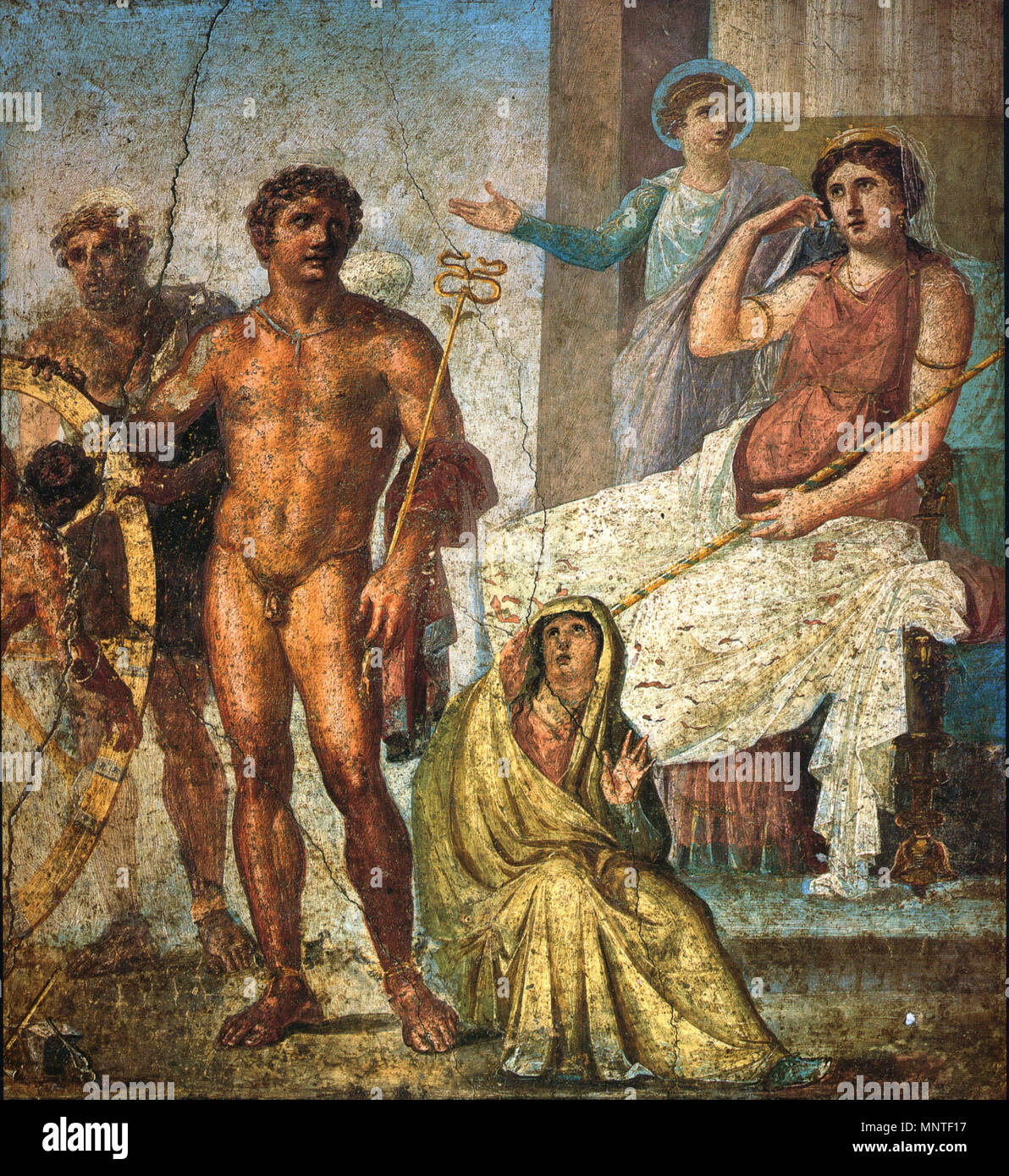 . English: Punishment of Ixion: in the center is Mercury holding the caduceus. On the right is Juno on her throne, and behind her Iris stands and gestures. On the left is Vulcanus (blond figure) manning the wheel, with Ixion already tied to the wheel. Nephele sits at Mercury's feet. Roman fresco from the eastern wall of the triclinium in the Casa dei Vettii ('House of the Vetii', VI 15, 1) in Pompeii, Fourth Style (60-79 AD). Deutsch: Bestrafung Ixions: im Vordergrund mit Stab Merkur, rechts Juno, dahinter Iris, ganz links Vulkan mit dem auf das Rad gebundenen Ixion. Zu Füßen von Merkur die si Stock Photo
