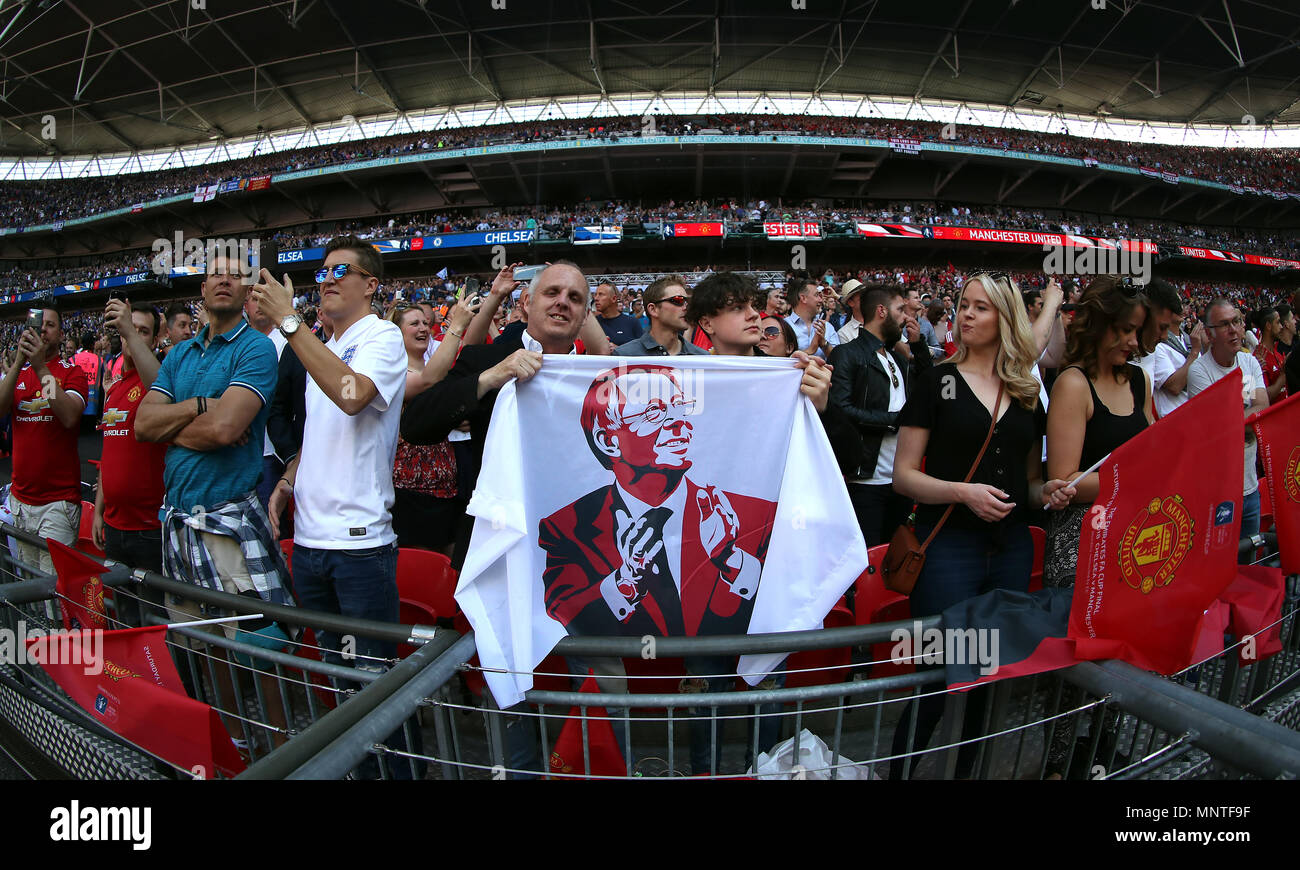 Manchester United fan holds up a flag of Sir Alex Ferguson during the  Emirates FA Cup Final at Wembley Stadium, London Stock Photo - Alamy