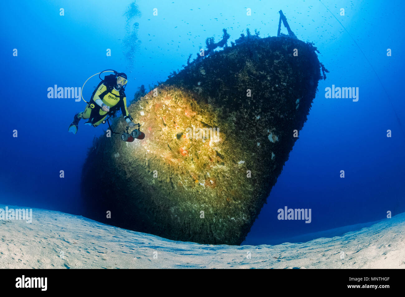 woman scuba diver, exploring shipwreck, P29, a Maltese patrol boat ...