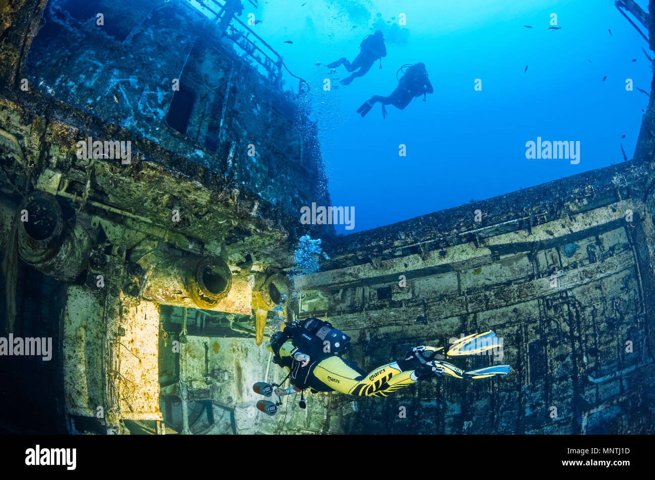 woman scuba diver, exploring shipwreck, P29, a Maltese patrol boat, formerly named, Boltenhagen (GS09), a German Kondor I-class minesweeper, Cirkewwa, Stock Photo