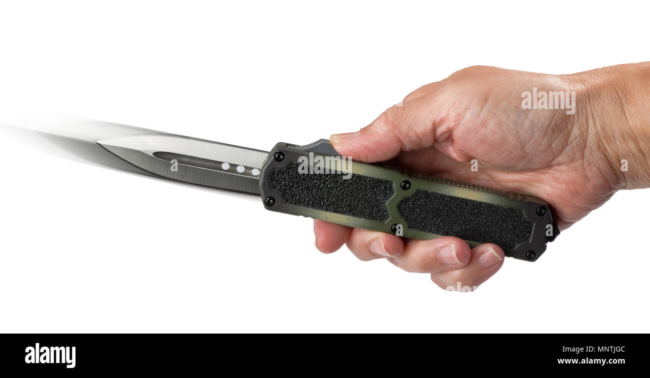 Automatic knife sometimes called a switchblade open with finger button. Stock Photo