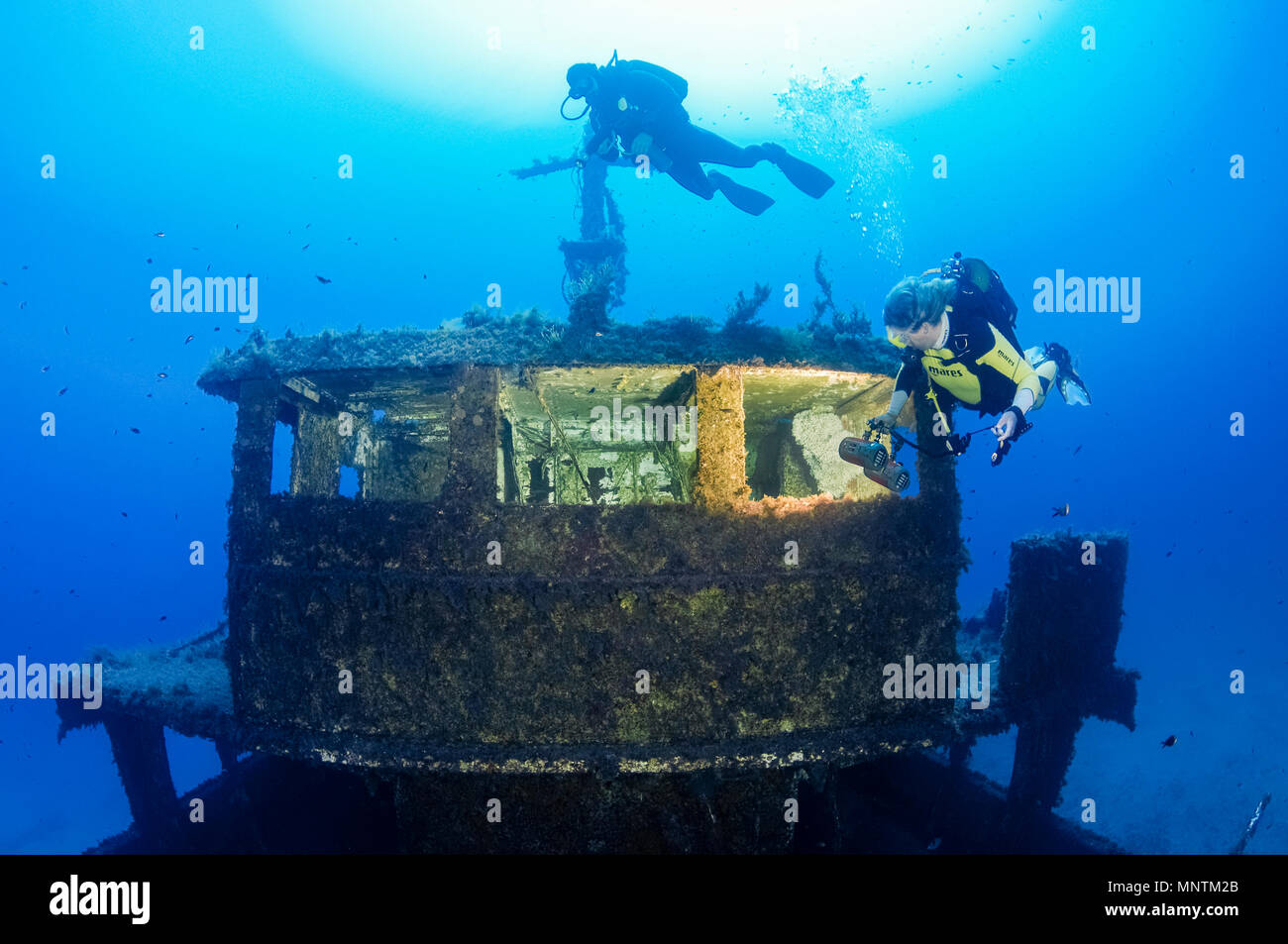 woman scuba diver, exploring shipwreck, MV Cominoland, Gozo, Malta, Mediterranean Sea, Atlantic Ocean, MR Stock Photo