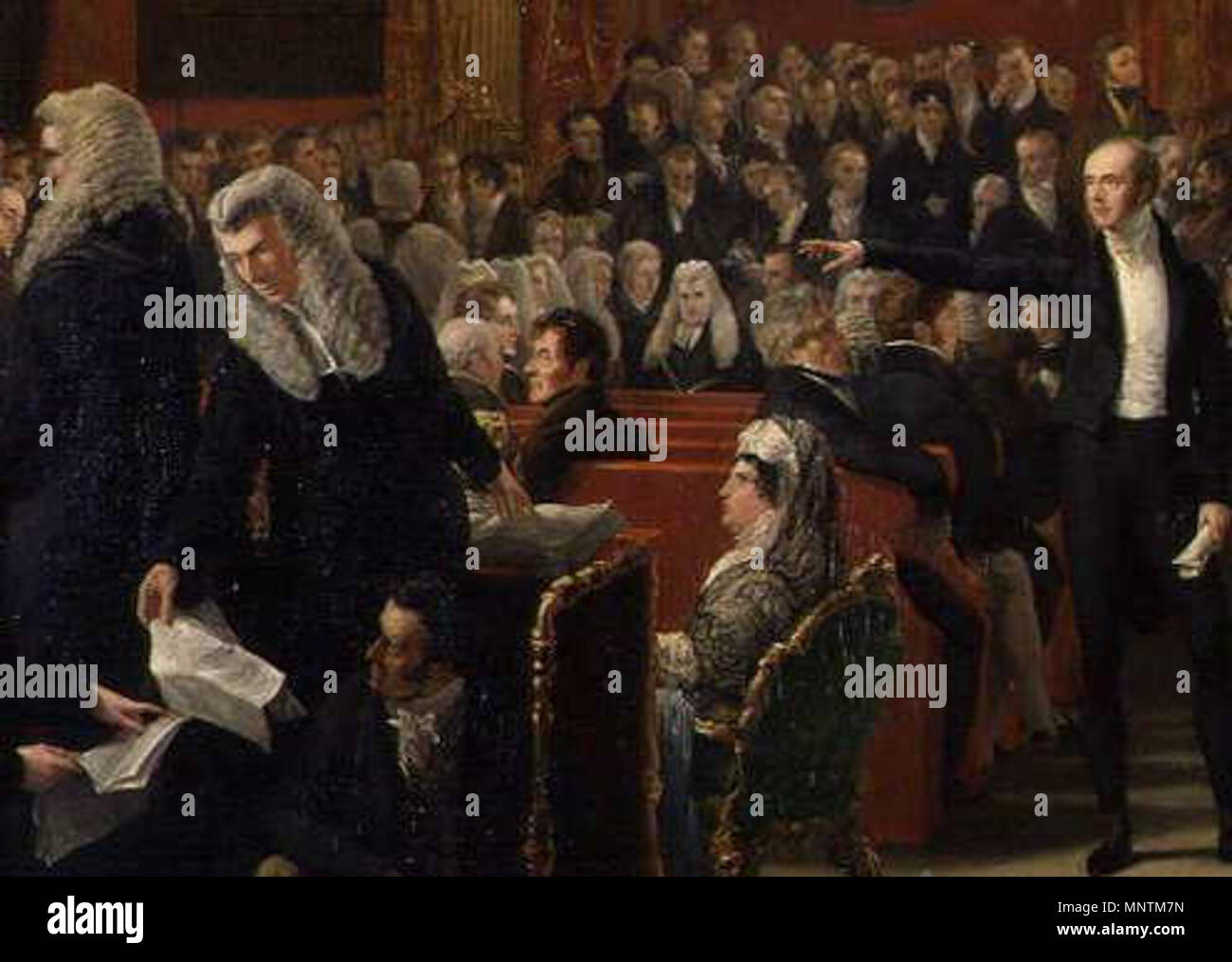 . English: (detail from) The Trial of Queen Caroline 1820 by Sir George Hayter - left to right: Stephen Lushington (in wig with back to painter); Henry Brougham (in wig handing sheet of paper downwards); William Vizard, the Queen's solicitor (on floor beneath Brougham); Lord Lauderdale (sitting on bench with back to painter); Lord Chancellor Lord Eldon (seated in background facing front); Queen Caroline; Lord Grey (with extended arm); Lord Effingham (beneath Lord Grey's hand facing Grey). Note this is an extract from a much larger painting. March 1820.   George Hayter  (1792–1871)     Descript Stock Photo
