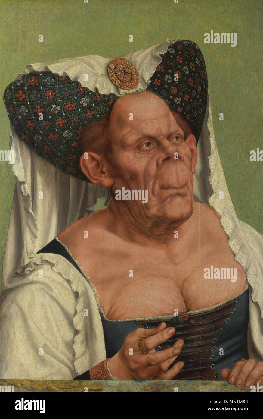 A Grotesque old woman Alternative titles: Portrait of an Old Woman The Ugly Duchess .  It was probably intended to satirise old women who try inappropriately to recreate their youth, rather than as a portrait of a specific person. [1] Pendant of Portrait of an old man, by Quinten Matsys . circa 1513.   1035 Quentin Matsys - A Grotesque old woman (cropped) Stock Photo