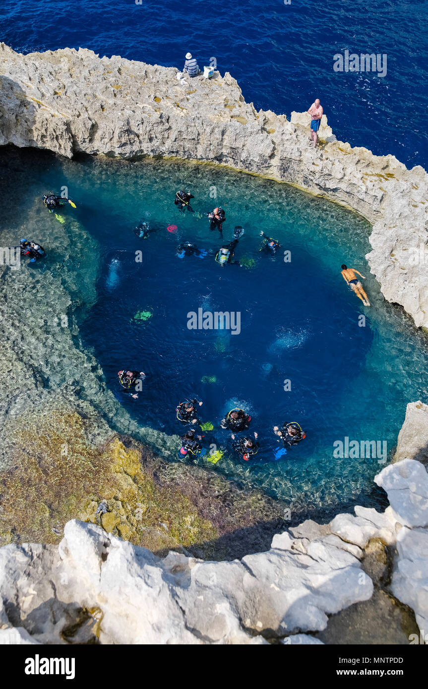 scuba divers and swimmers at Blue Hole, Gozo, Malta, Mediterranean Sea, Atlantic Ocean Stock