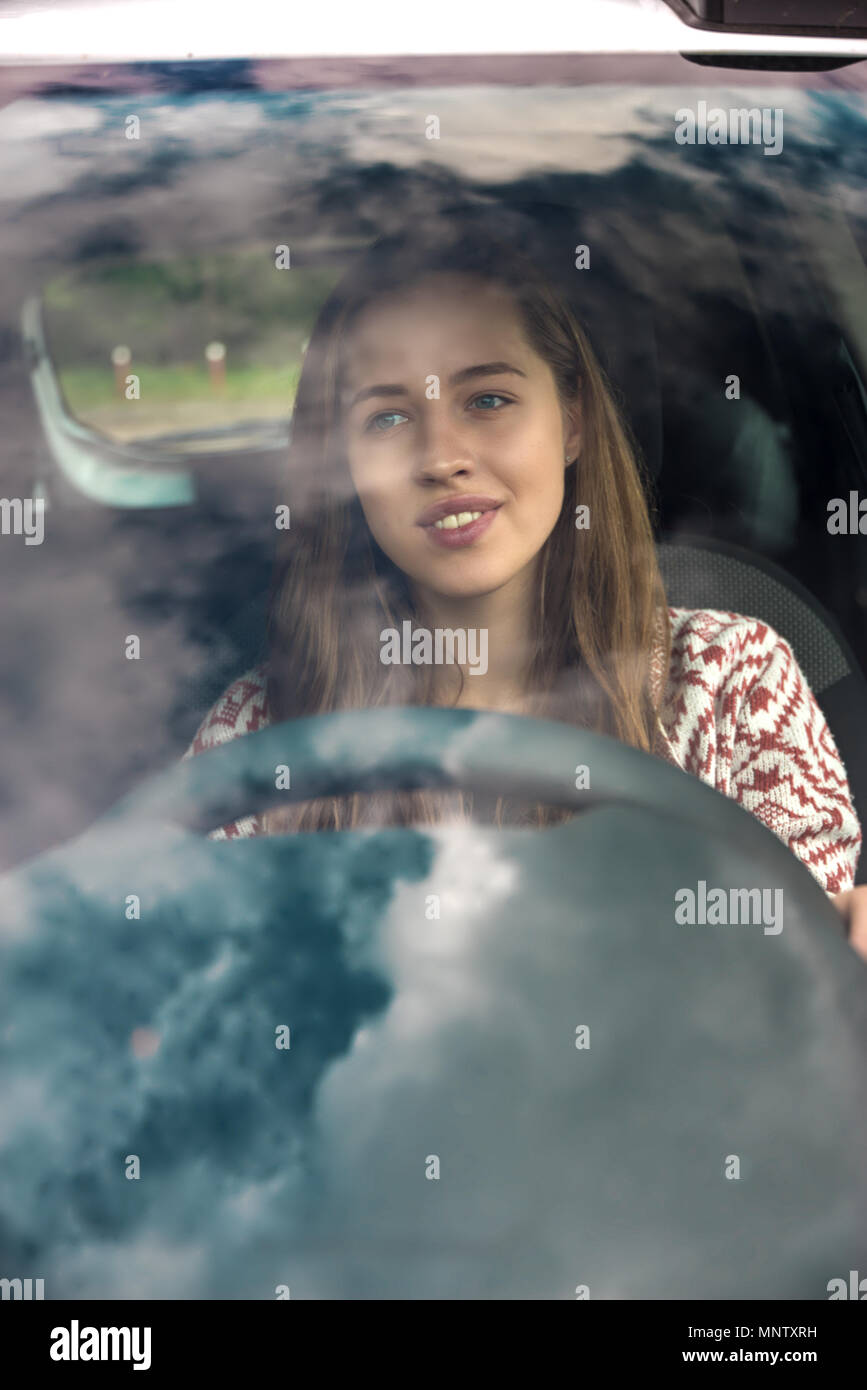 Girl behind steering wheel hi-res stock photography and images - Alamy