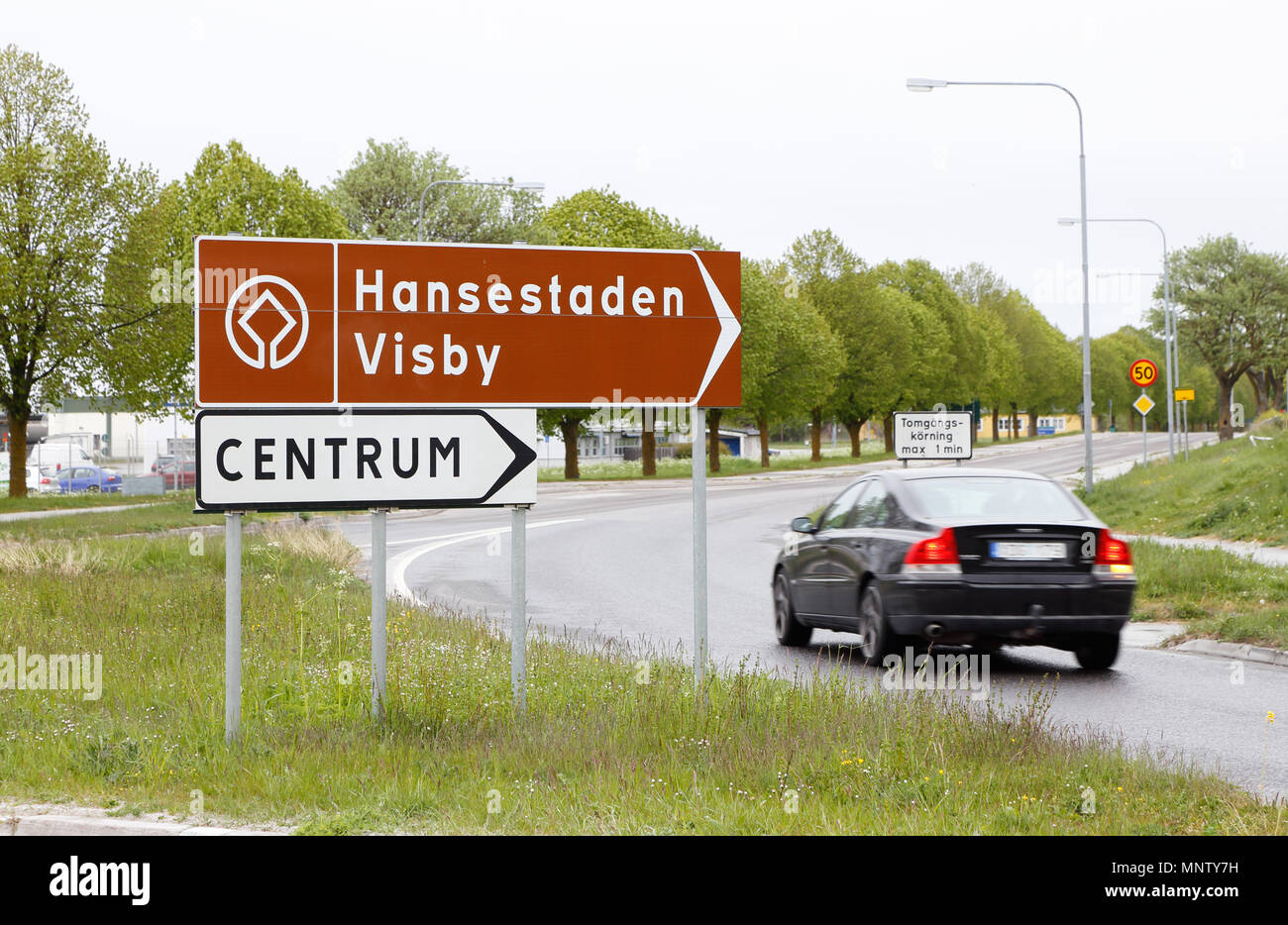 Visby, Sweden - May 15, 2016: Signpost at the Farjeleden road with direction to world heritage site Visby and its city center in Swedish province of G Stock Photo