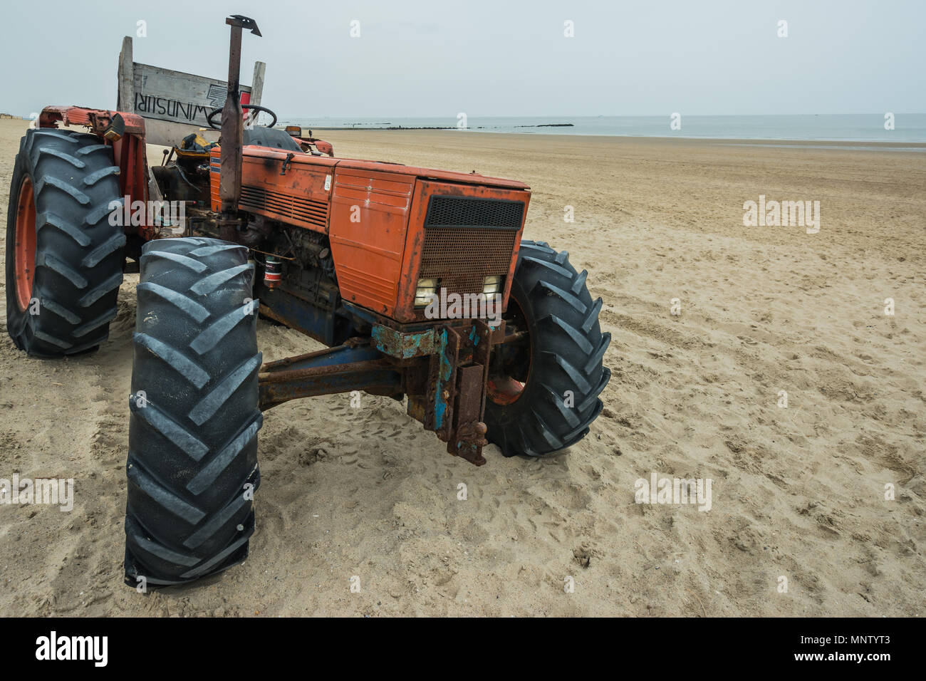 Tractor on the beach Stock Photo - Alamy