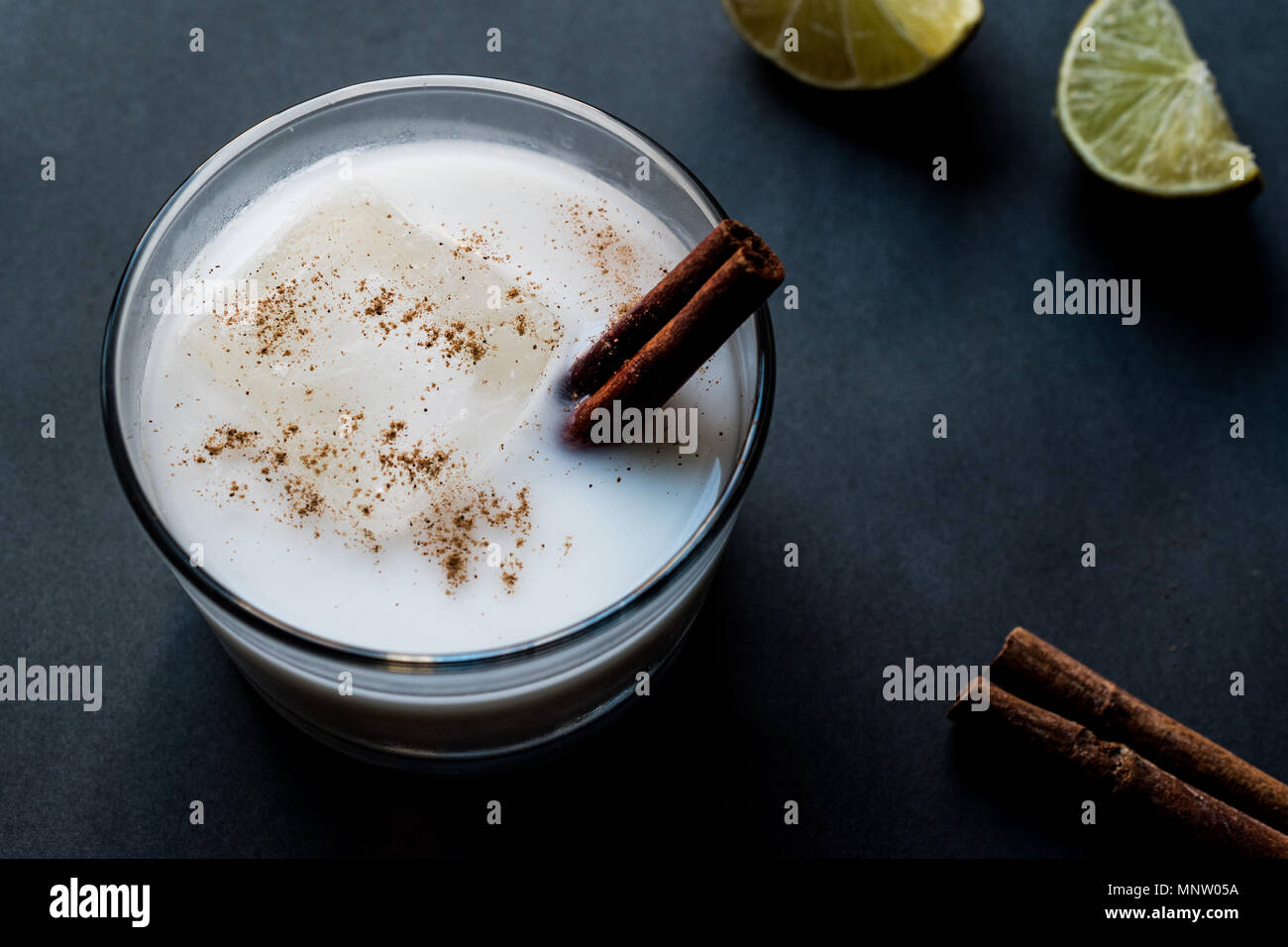Horchata with Cinnamon stick and lime. Stock Photo