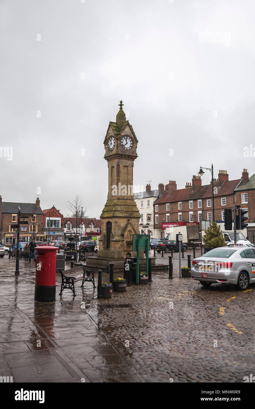 The market place in Thirsk,North Yorkshire,England,UK with the market clock Stock Photo
