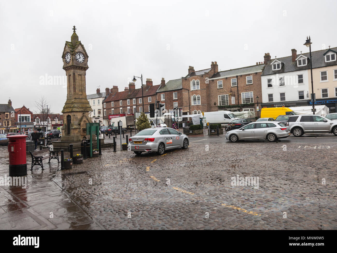 The market place in Thirsk,North Yorkshire,England,UK with the market clock Stock Photo