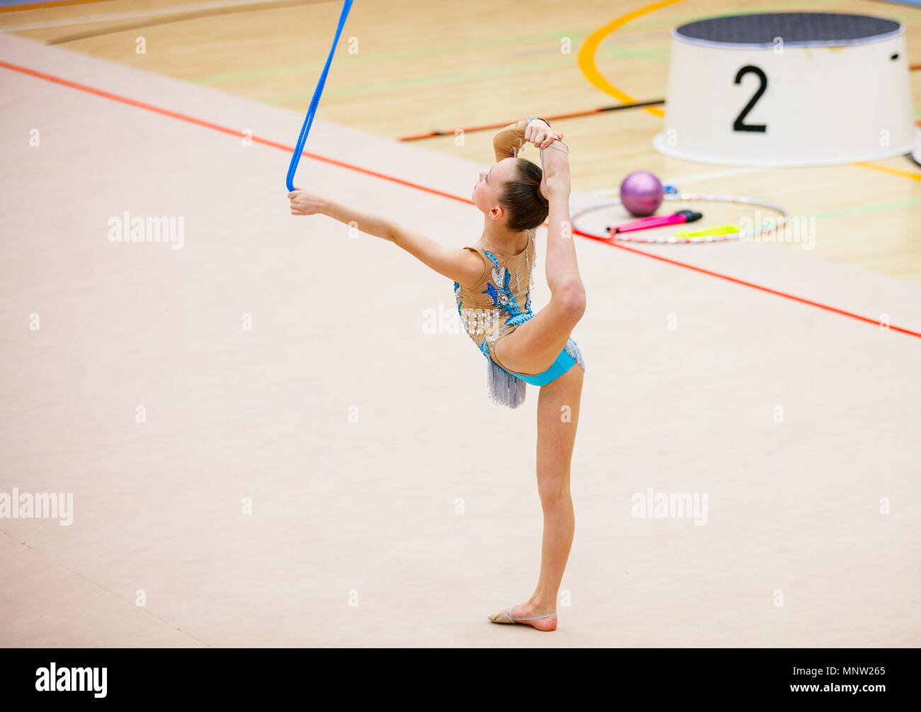 Adorable girl with rope competing in rhythmic gymnastics Stock Photo Alamy