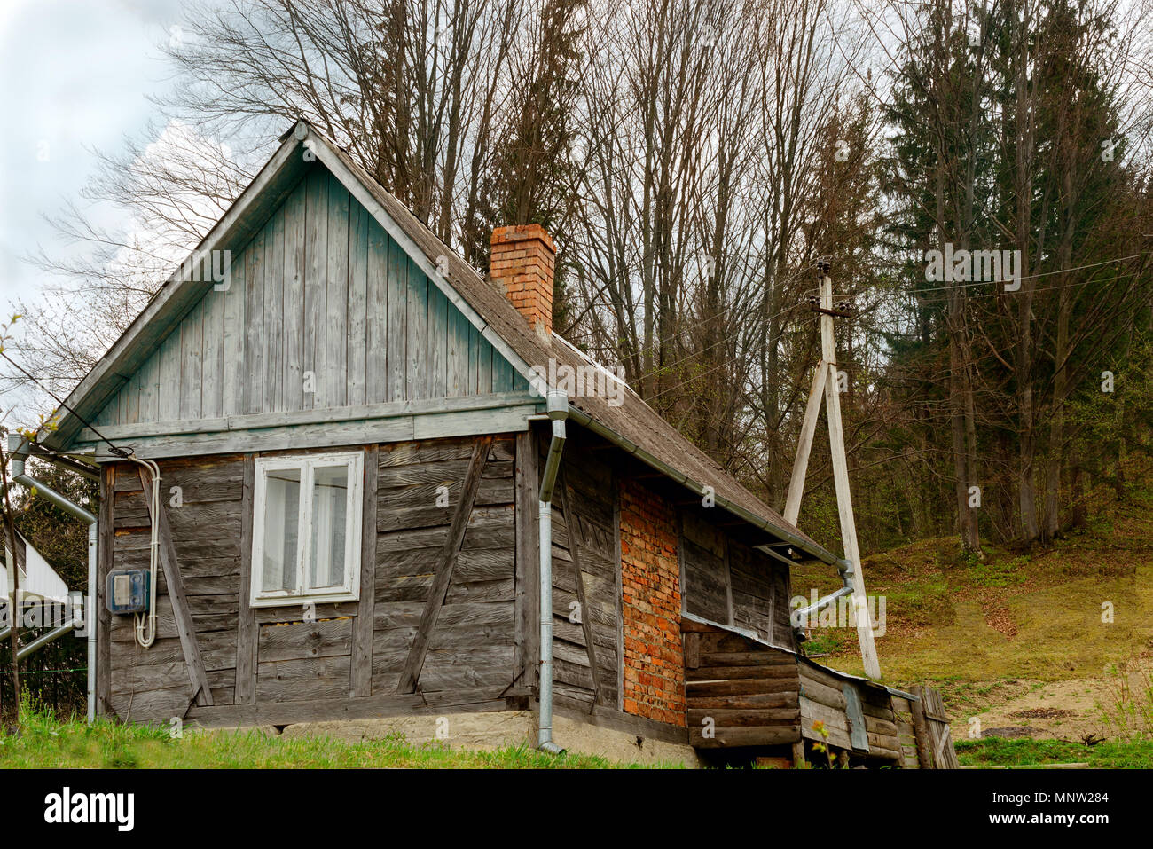 Old-fashioned wooden house on the outskirts of the forest. Among the Carpathian mountains in Ukraine. Outdoors. Close-up. Stock Photo