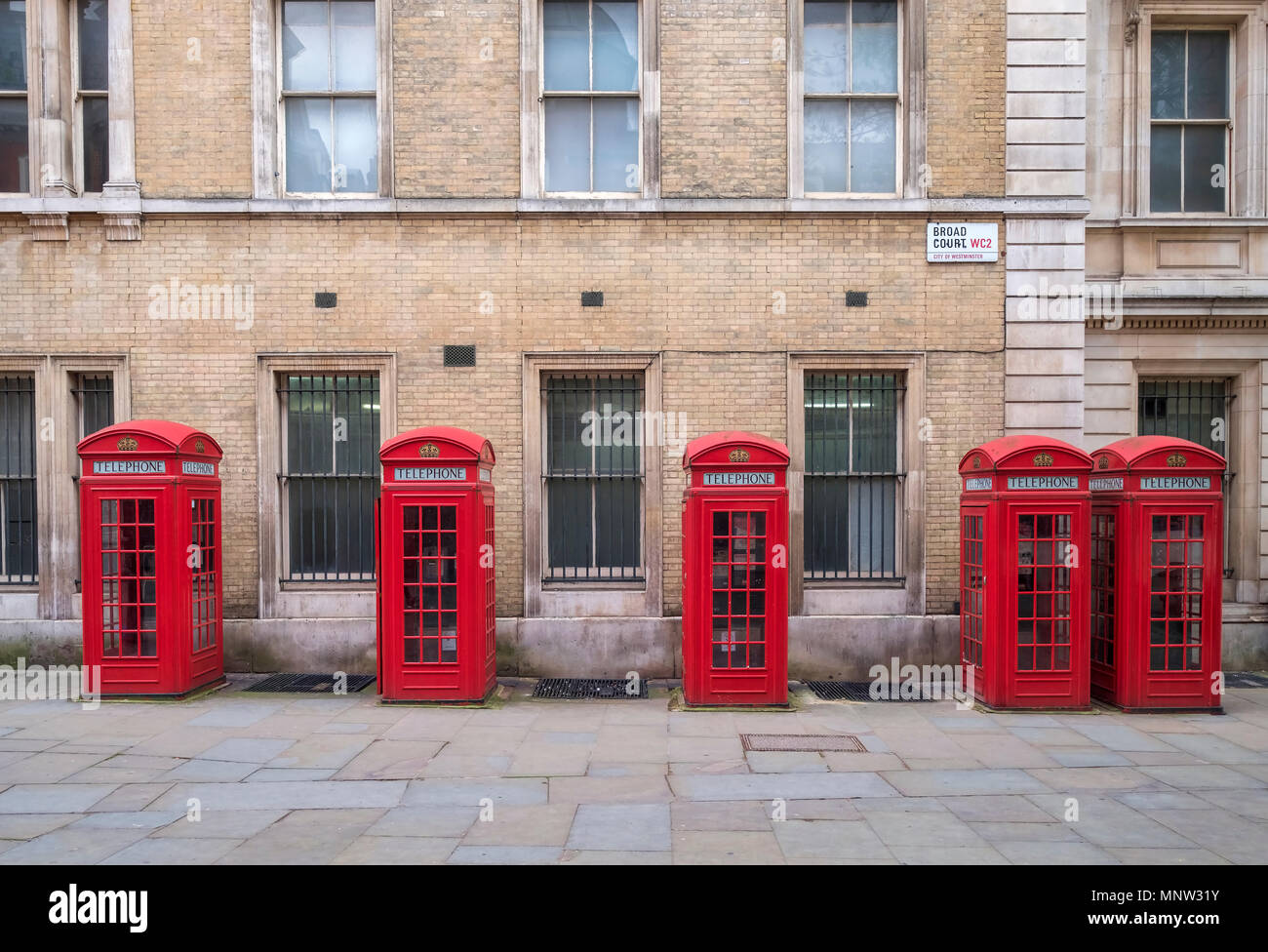 A row of British Red Telephone Boxes, Broad Court, Covent Garden, London, England, UK Stock Photo