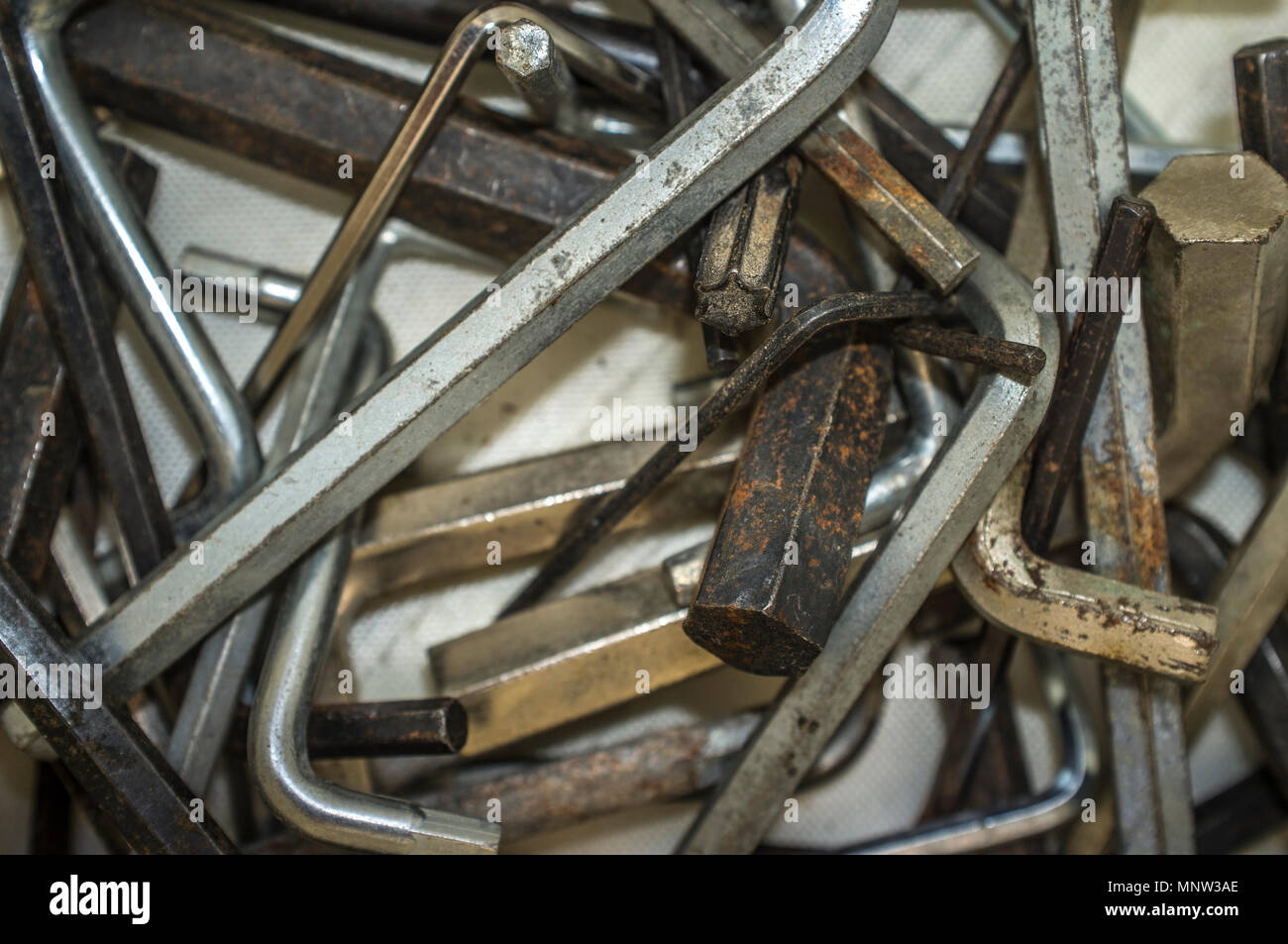 Box full of used hex keys for end-user assembly furniture. Closeup Stock Photo