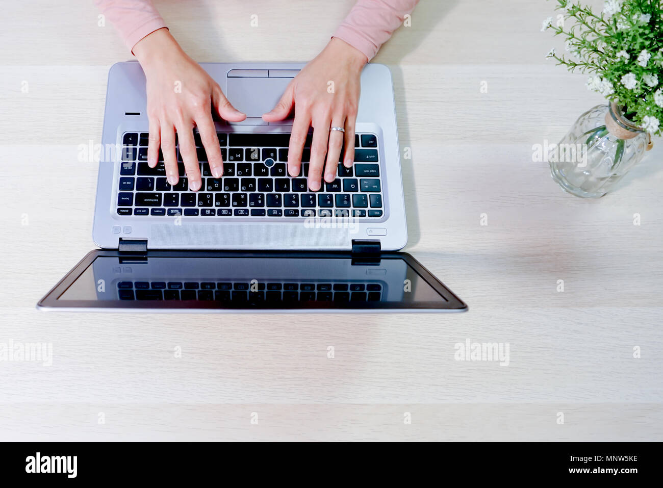 focus on woman hand using laptop, searching, checking, browsing information Stock Photo