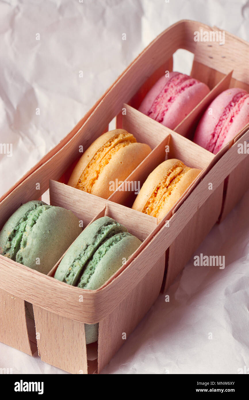 Multicolored macaroon in a box with three compartments Stock Photo