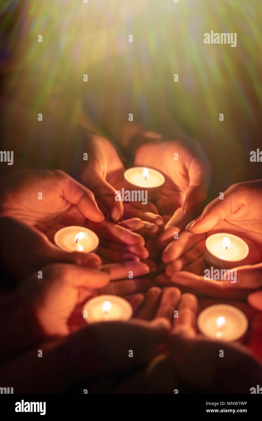 prayer with candles in hands Stock Photo Alamy