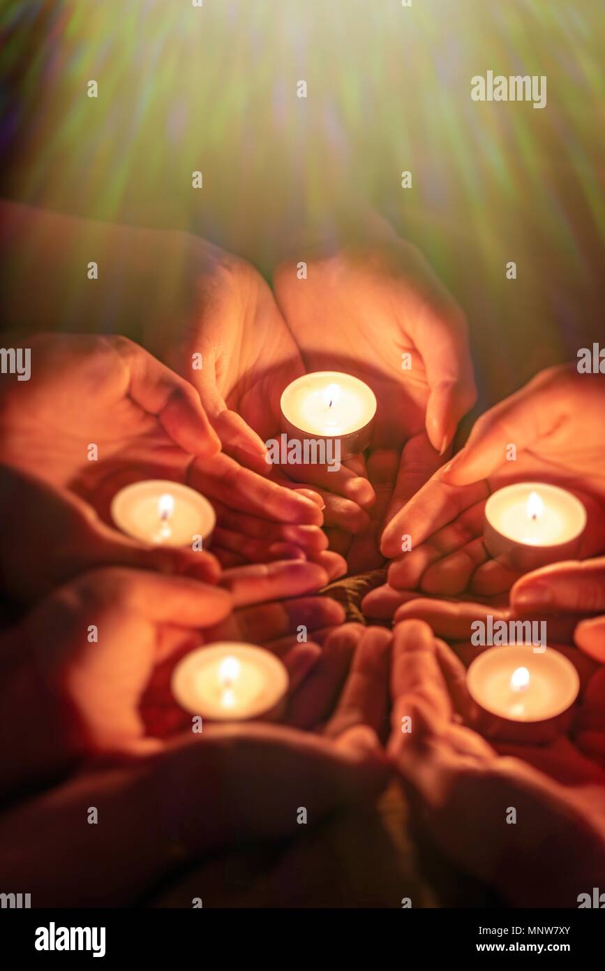 prayer with candles in hands Stock Photo Alamy