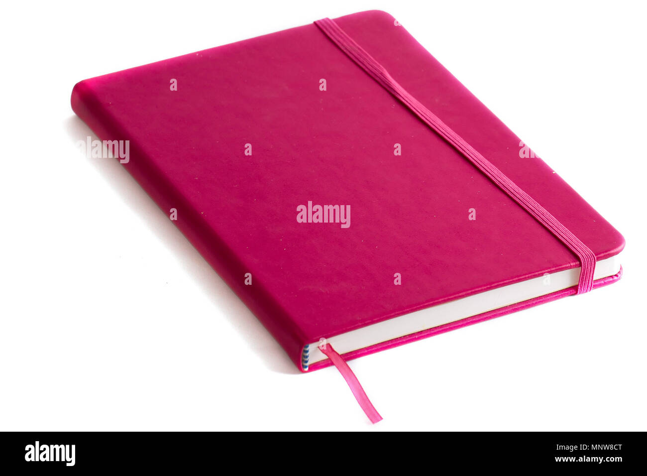 Closed notebook on a white background Stock Photo - Alamy