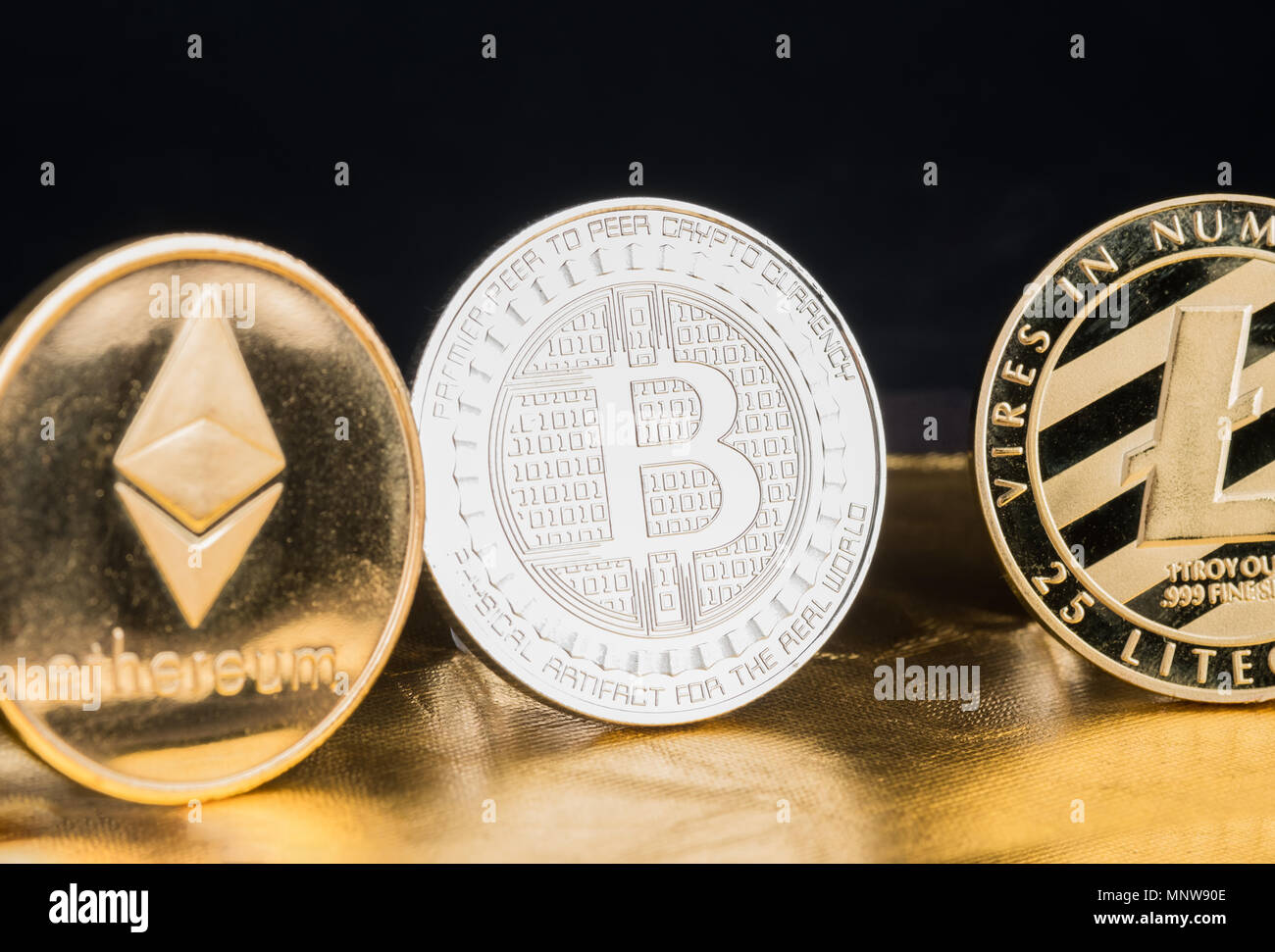 Cryptocurrency litecoin,Silver Bitcoin,Ethereum on golden rough  background,Digital cryto currencies.Virtual money Stock Photo - Alamy