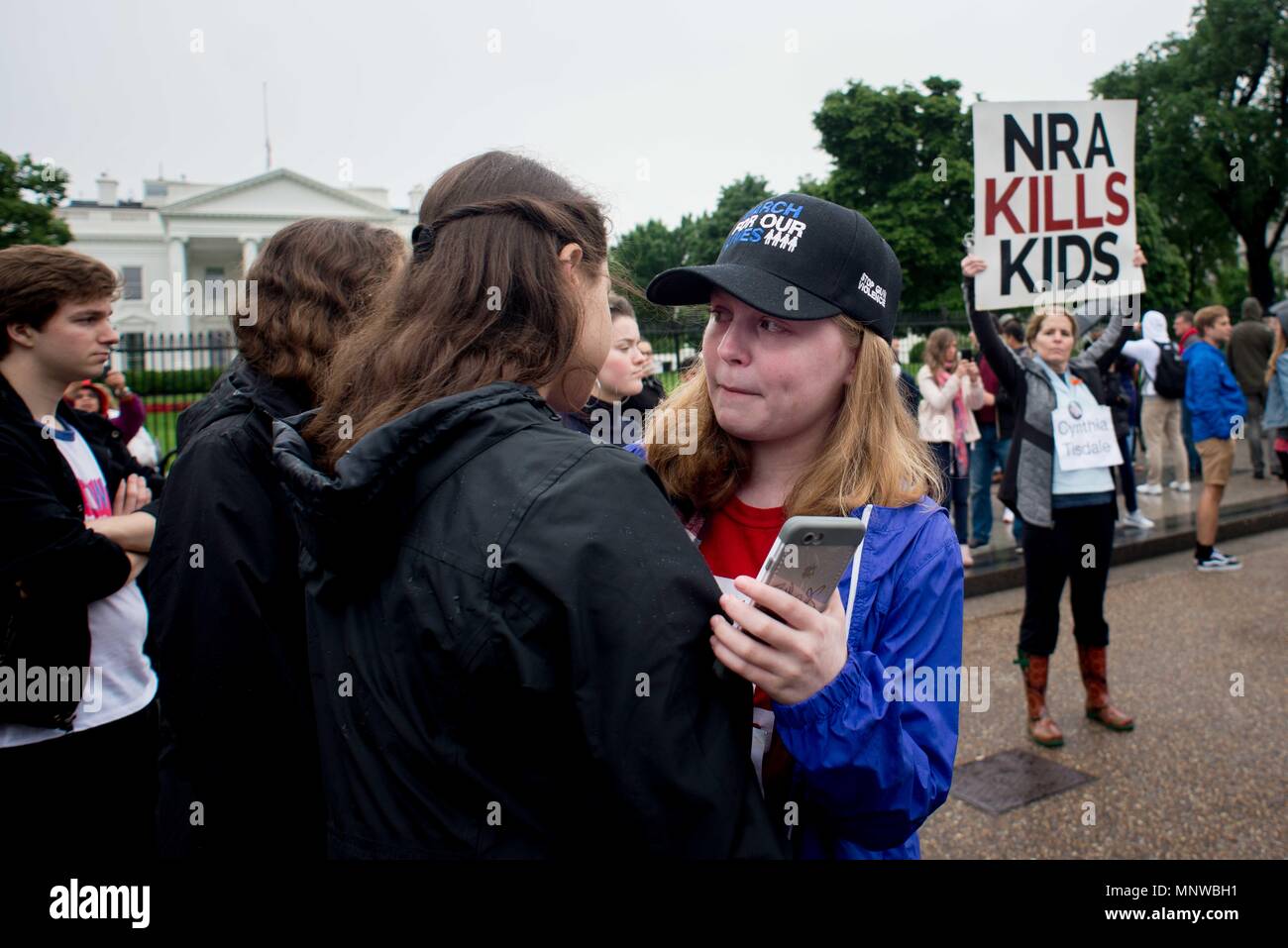 Washington, District of Columbia, USA. 19th May, 2018. A student organizer becomes emotional while demonstrating at a ''lie-in'' in front of the White House to honor the victims of the Santa Fe High School shooting in Texas. The group is demanding the U.S. president and Congress work to pass gun control legislation. Credit: Erin Scott/ZUMA Wire/Alamy Live News Stock Photo
