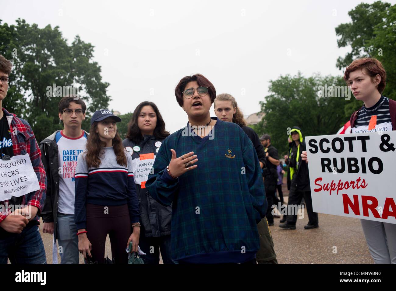 Washington, District of Columbia, USA. 19th May, 2018. Cheema, a foreign-exchange student from Pakistan, speaks at an anti-gun protest in front of the White House. She came to the U.S. in the same group of students as Sabika Sheikh, one of the victims in the Santa Fe High School shooting in Texas. Credit: Erin Scott/ZUMA Wire/Alamy Live News Stock Photo