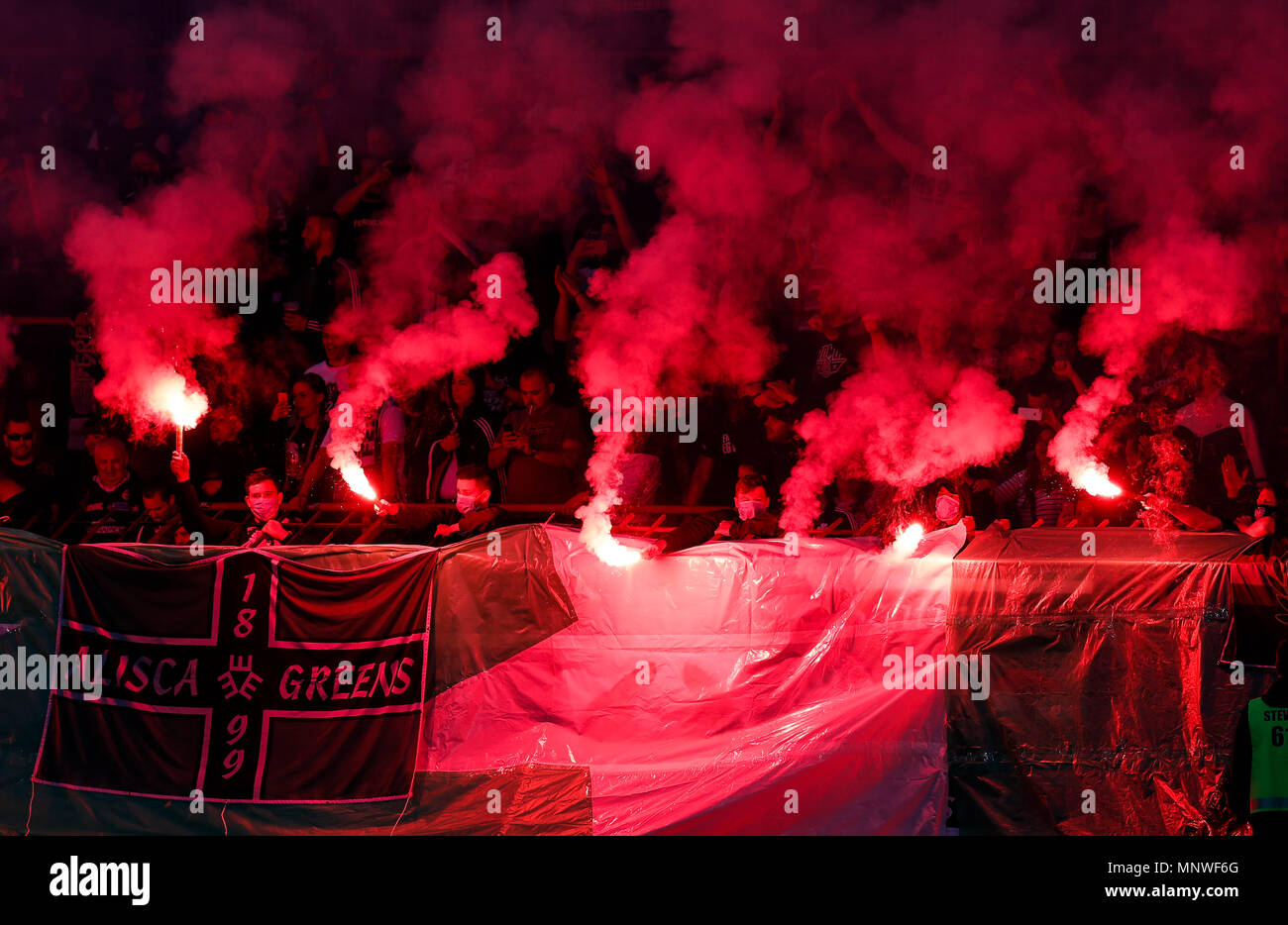 BUDAPEST, HUNGARY - MAY 19: Ultra fans of Ferencvarosi TC (called Green Monsters) light torches and make smoke during the Hungarian OTP Bank Liga match between Budapest Honved and Ferencvarosi TC at Bozsik Stadium on May 19, 2018 in Budapest, Hungary. Credit: Laszlo Szirtesi/Alamy Live News Stock Photo