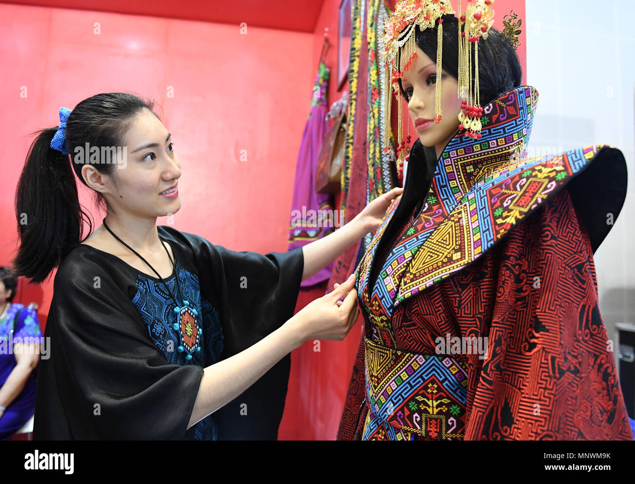 China. 20th May 2018. Fan Lihua arranges an wedding dress of