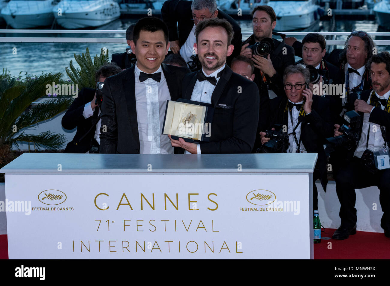 Cannes, France. 19th May 2018.  Australian director Charles Williams, short film Palm d'Or award winner for his film 'All These Creatures' poses with Wei Shujun special mention award winner for his film 'Border' at the photocall the Palme D'Or Winner during the 71st annual Cannes Film Festival at Palais des Festivals on May 19, 2018 in Cannes, France Credit: Norbert Scanella/Alamy Live News Stock Photo