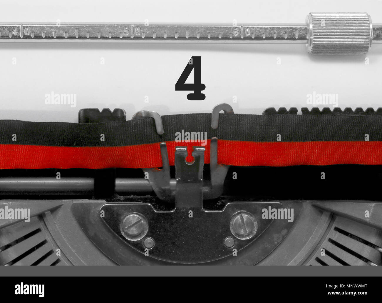 4 Number text written by an old typewriter on white sheet Stock Photo