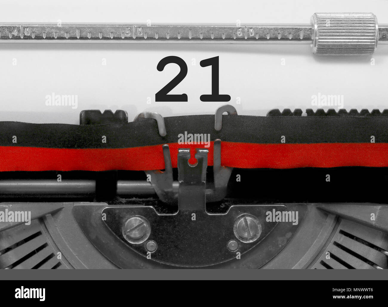 21 Number text written by an old typewriter on white sheet Stock Photo