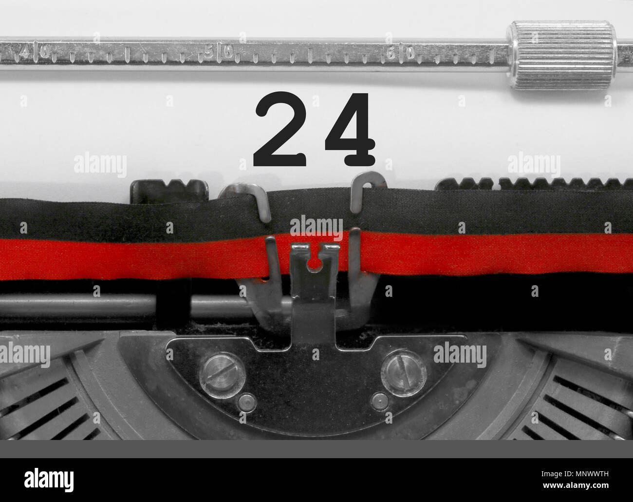 24 Number text written by an old typewriter on white sheet Stock Photo