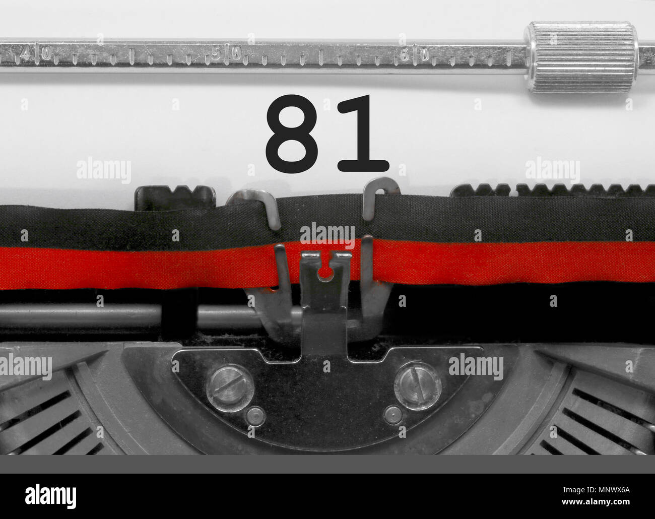 81 Number text written by an old typewriter on white sheet Stock Photo