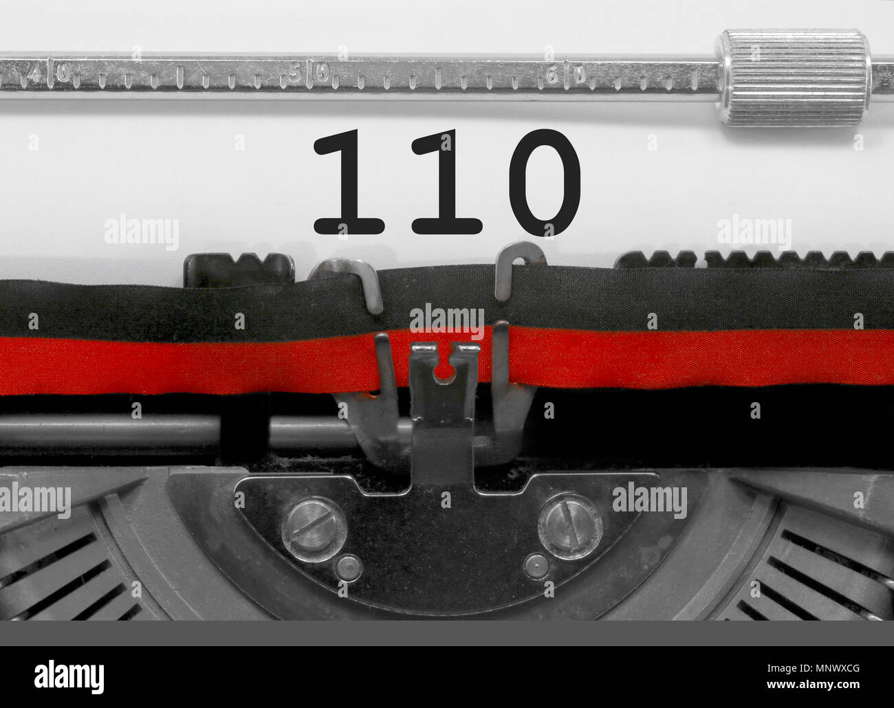 110 Number text written by an old typewriter on white sheet Stock Photo