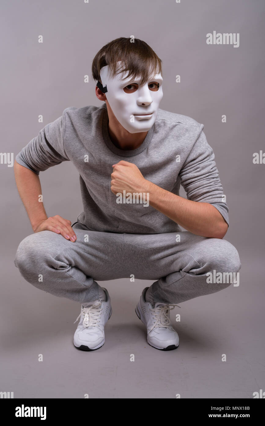 Man wearing an anonymous mask hi-res stock photography and images - Alamy