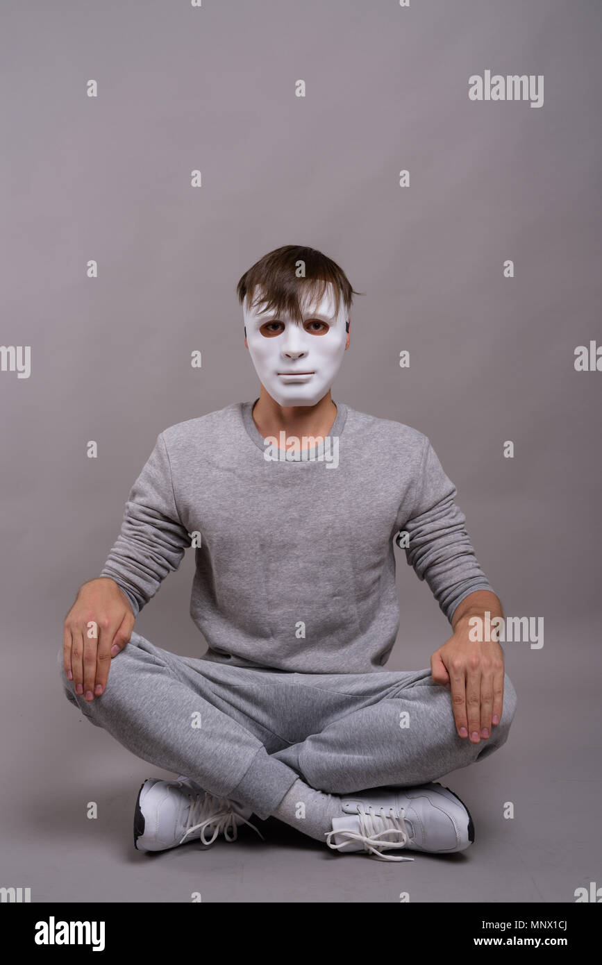 Man wearing an anonymous mask hi-res stock photography and images - Alamy