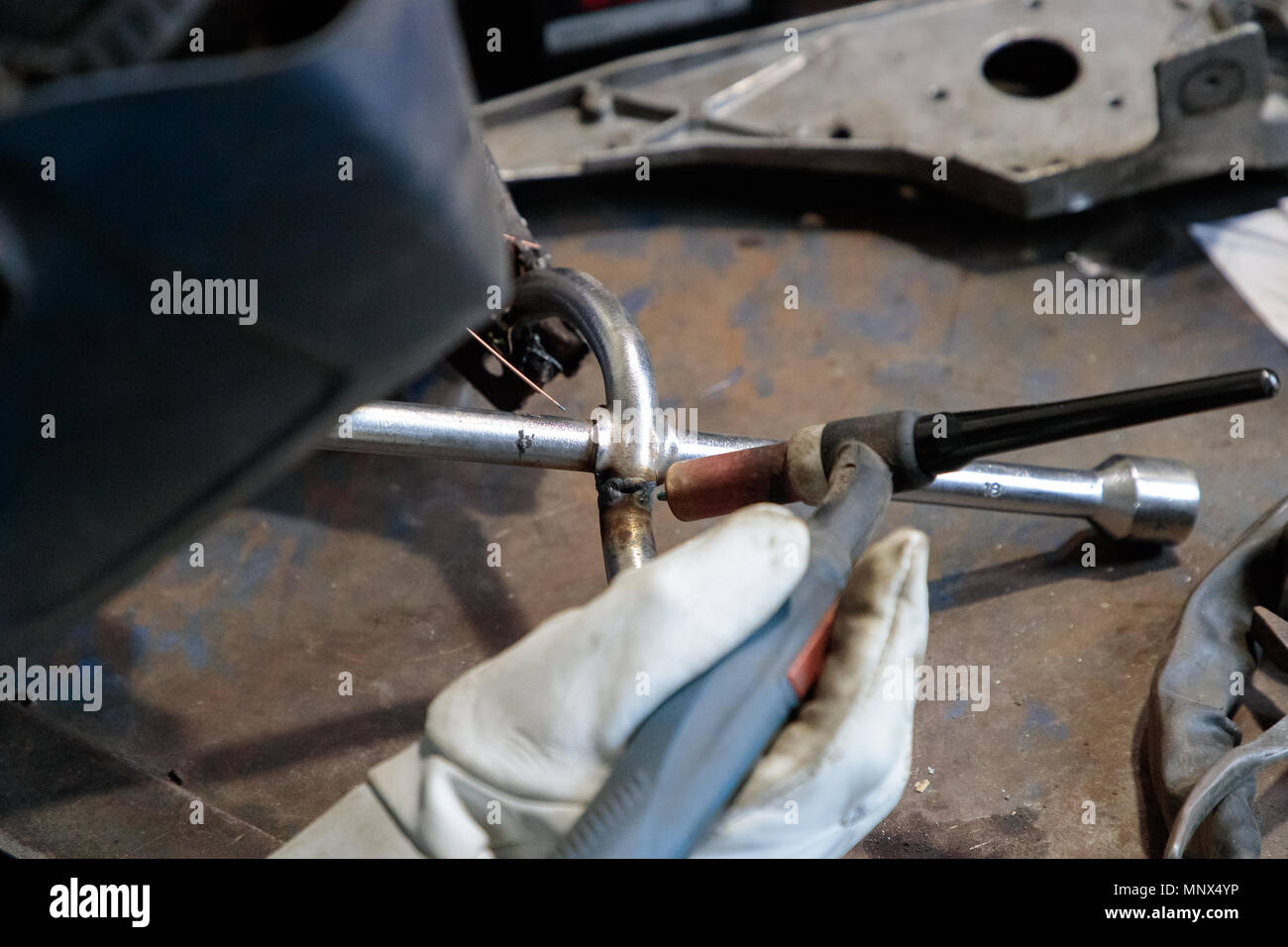 hands of the welder solder and connect the parts Stock Photo Alamy