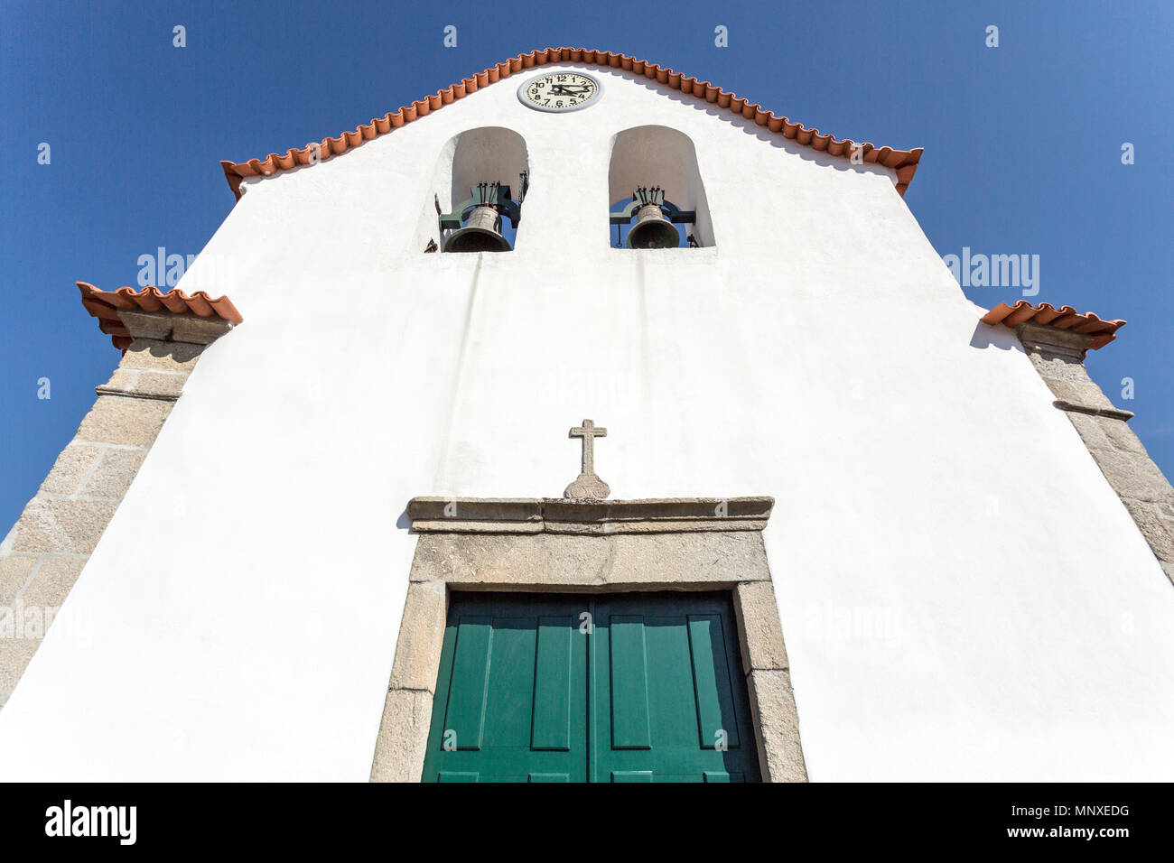 Facade of the Church of Our Lady of the Assumption, a simple church built in the 18th century within the walls of the castle of Vinhais, Portugal Stock Photo