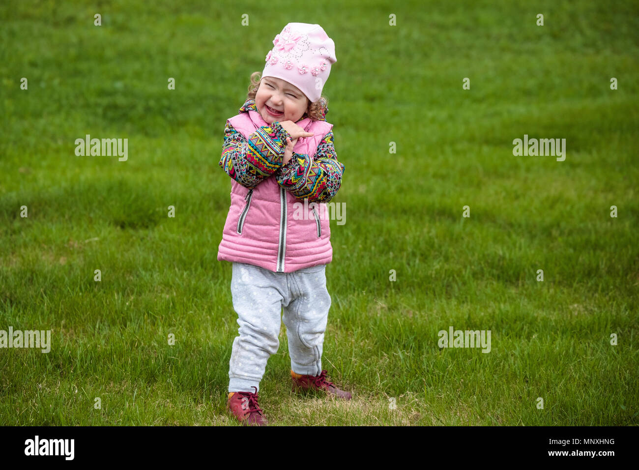 cute and little positive child on the street Stock Photo