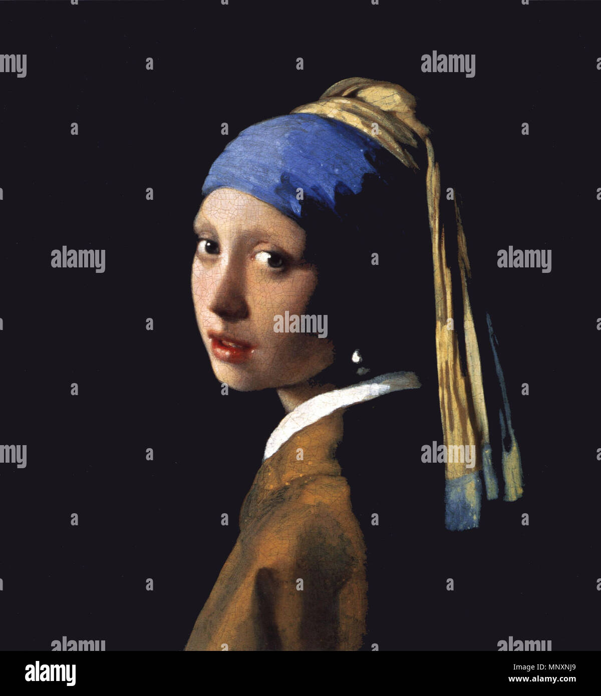 Girl with a Pearl Earring .  English: The Girl With The Pearl Earring (1665) at the Royal Picture Gallery Mauritshuis - The Hague . 1665. Unknown 1174 The Girl With The Pearl Earring (1665) 2 Stock Photo