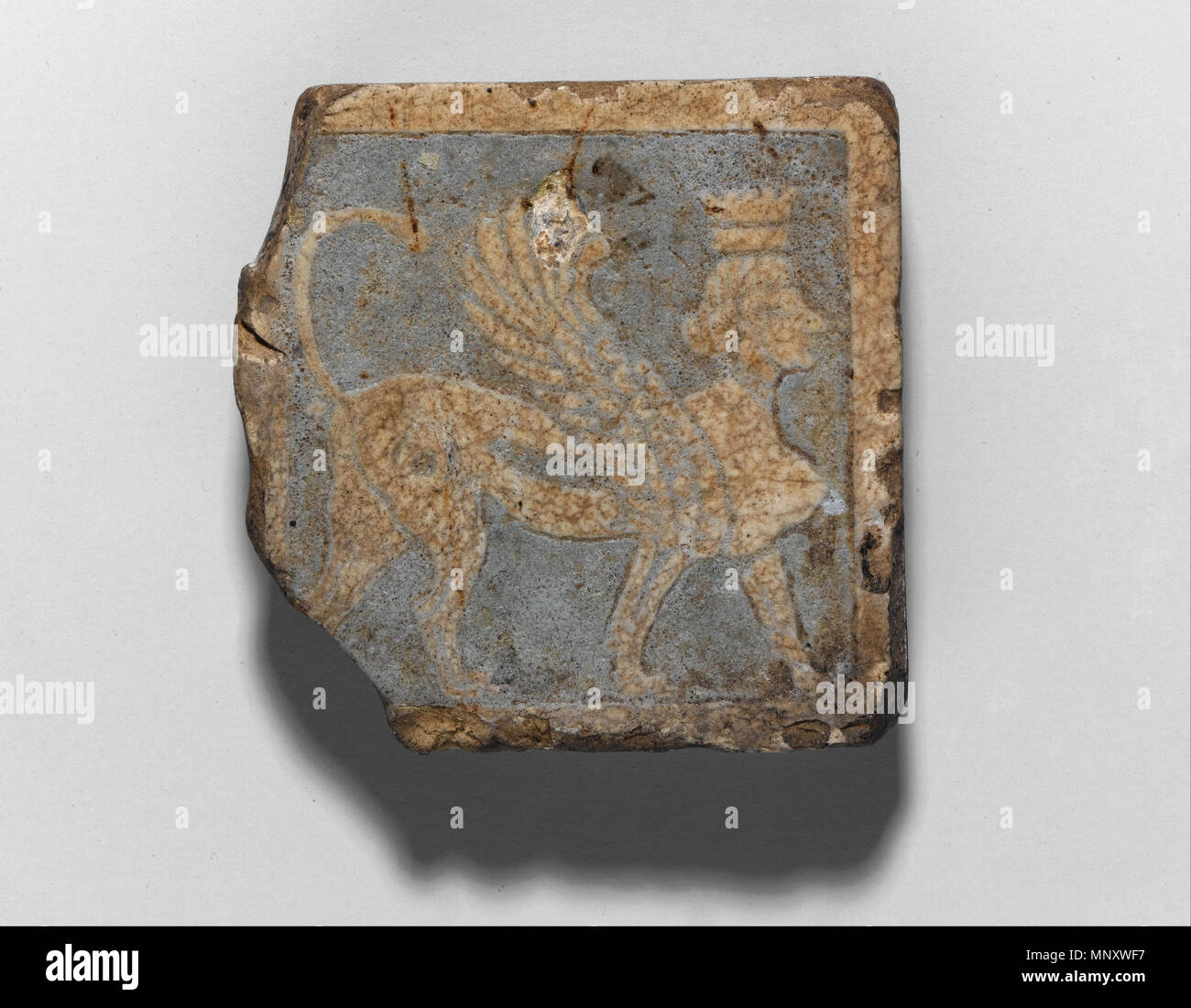 Tile with Winged Crowned Female Sphinx   3rd century B.C.E..   1193 Tile with Winged Crowned Female Sphinx - Google Art Project Stock Photo